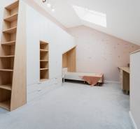 Children's room with soft pastel walls and built-in furniture in a 4-room apartment.