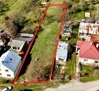 Building plot bordered by a red line in Moravské Lieskové, surrounded by houses.