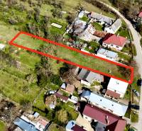 Aerial view of a plot under construction of houses in Moravské Lieskové, highlighted with a red outline.