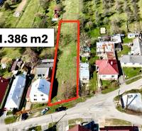 Land for house construction in Moravské Lieskové, area 1,386 m2, surrounded by houses.