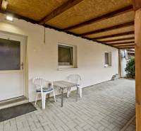 In Malé Leváre, there is a spacious terrace at the 2-room apartment with plastic chairs.