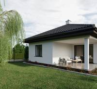 A family house with a terrace on Pánska Niva street, surrounded by green lawn and trees.