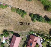 Aerial view of a 2000 m² plot suitable for residential use in Banská Štiavnica on SNP Street.