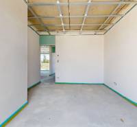 Interior of a family house with finished plastering and ready electrical installation.