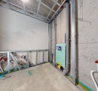 Construction of a bathroom with plumbing and installations in a family house.