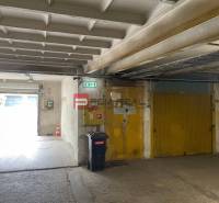 Garages with yellow doors, a trash can, and an exit, interior.
