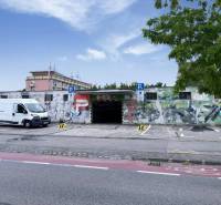 Garages on Pionierska Street in Bratislava III with colorful graffiti design on the walls.
