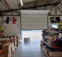 Šamorínská street, warehouses and halls full of goods with open warehouse doors.