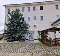 Building on Šamorínska Street with parking, connected with the Real Home office. Warehouses and halls.