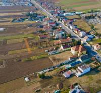Aerial view of Chrabrany in Topoľčany with rural buildings and fields.