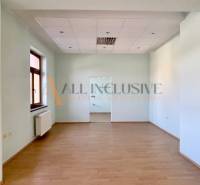 Bright, spacious room with a floor and a window in the building.