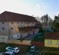 Production premises in Kovarce on Hlavná Street, with a spacious courtyard and greenery.