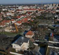 Panorama of villas in Topoľčany on Športovcov Street with red-roofed houses.