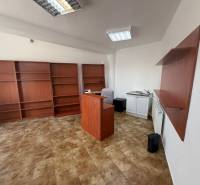 Offices with shelves, a counter, and a cabinet with a sink.