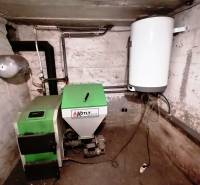 Boiler room with a solid fuel boiler in a family house.