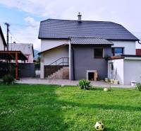 A family house in Sučany near Martin with a lawn and a shelter.