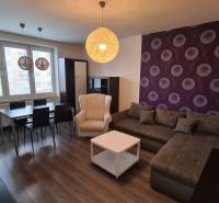 Elegant living room in a 2-room apartment with modern decor and comfortable seating.