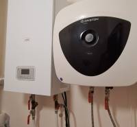 Bathroom corner in a 3-room apartment with a water heater and a boiler.