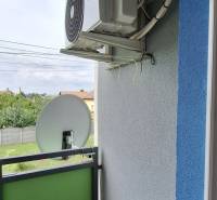 Balcony of a 3-room apartment with air conditioning and satellite, garden view.