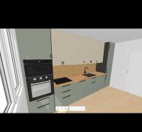 A kitchen in a 2-room apartment with built-in appliances and a wooden countertop.