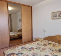 Bedroom with a built-in wardrobe and a double bed in a 4-room apartment.