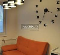 Interior of a 3-room apartment with a balcony, window with blinds, patterned wallpaper.