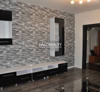 Living room in a 3-room apartment with a decorative wall and modern furniture.
