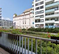 View from the balcony with flowers to the buildings on Jégého Street in Bratislava.