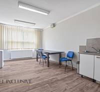 The office equipment includes a desk, chairs, a sink, a faucet, and blinds.