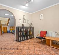 Offices with a display cabinet, relaxation zone, and staircase.