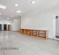 Commercial space with wooden shelves and tiles, suitable for various uses.