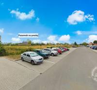 Parking lot next to a commercial property on Priemyselná Street in Piešťany.