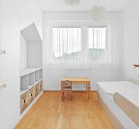 Children's room in a 4-room apartment with wardrobes, a bed, and a desk.
