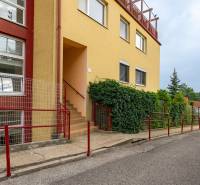 Apartment building with a yellow facade on Guothova Street in Bratislava, Kramáre.