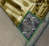 Aerial view of commercial land in Trenčianske Bohuslavice with marked dimensions and entrance.