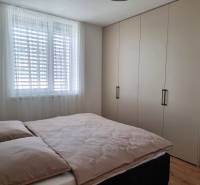 A bedroom with a large wardrobe and a double bed in a 3-room apartment.