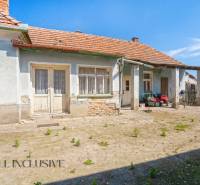 A family house in Jahodná with traditional architecture, two entrances, and a courtyard.