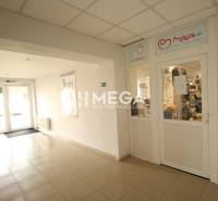 Interior commercial spaces with a glass entrance, the store contains children's products.