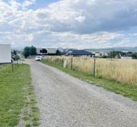 Plots - housing on Vodárenská Street in Ľubotice with a cottage road and a view of the countryside.