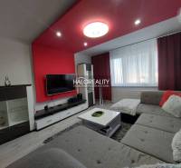 Living room in a 3-room apartment with comfortable seating and a television.