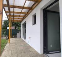 The terrace of a family house in Malé Kršteňany with a roof shelter and access to the garden.