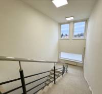 The staircase with windows provides light on Sadová Street, suitable for a 2-room apartment.