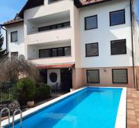 A building with a pool on Pod Párovcami Street in Piešťany, ideal for a 2-bedroom apartment.