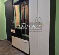 Studio apartment with a built-in wardrobe and a mirror in the hallway.