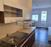 Compact studio apartment with a kitchenette, living area, and balcony in Šaľa.