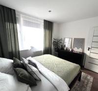 Bedroom in a 4-room apartment with stylish decor and furniture.