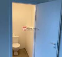 Restroom in commercial premises with a simple and clean design.