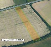 Aerial view of agricultural and forest land near Lučenec with a marked parcel.