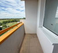 The balcony of a 3-room apartment on Železiarenská Street in Galanta with a view of the countryside.