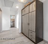 A hallway in a family house with a closet and an entrance to the toilet.